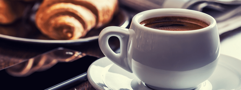 Coffee and pastries on a desk