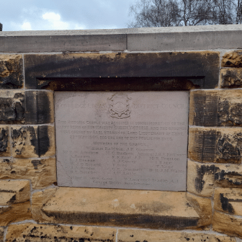 The memorial stone of the purchase of the castle at the entrance to the grounds